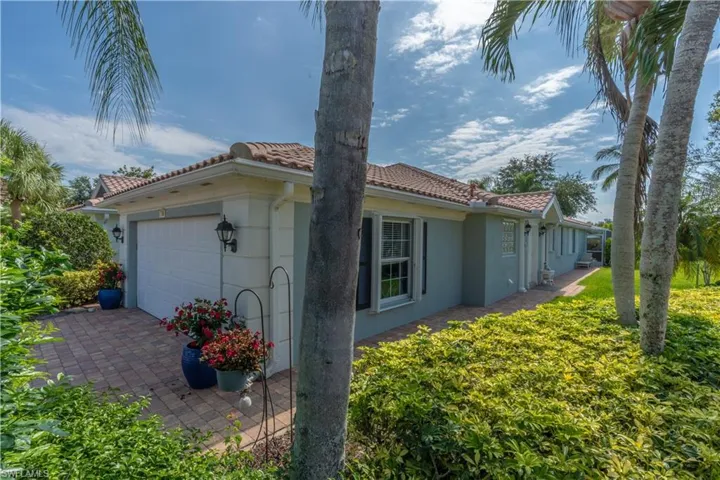 View of side of home with a garage