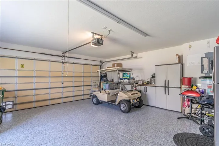 Garage featuring a garage door opener