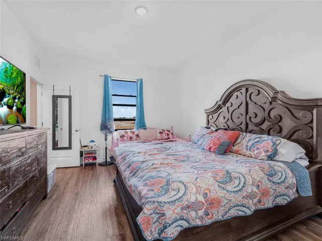 Bedroom with wood finished floors