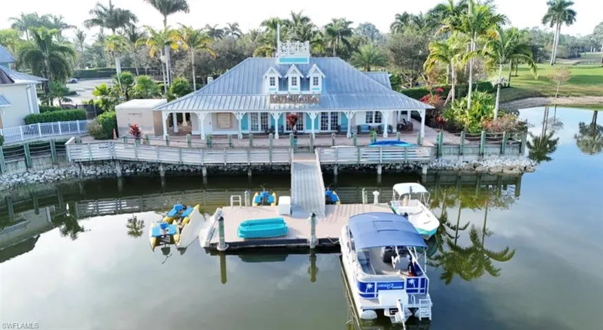 Dock area with a water view and a patio area