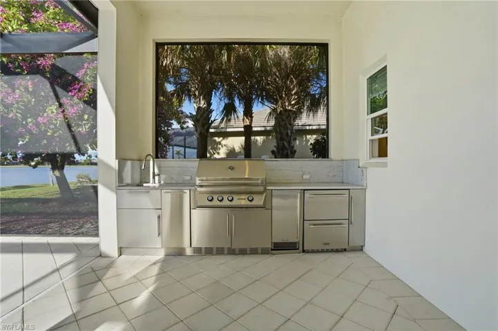 View of patio / terrace with an outdoor kitchen and a sink