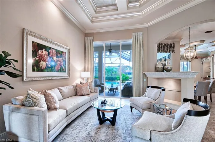 Living Room with slider to lanai, highly detailed ceiling with fresh aesthetic.