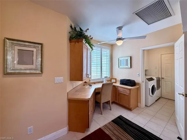 Office area featuring built-in desk area