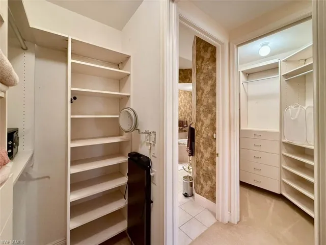 Spacious closets with built-in cabinets, small safe, pant press