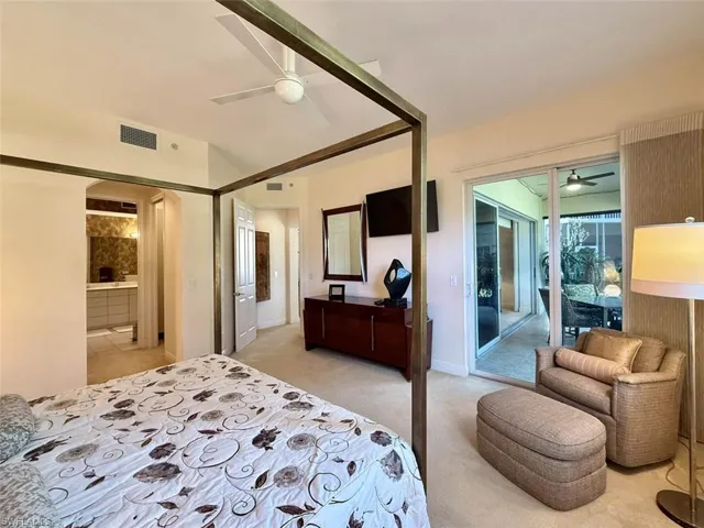 Bedroom with ceiling fan, access to lanai, , and light colored carpet