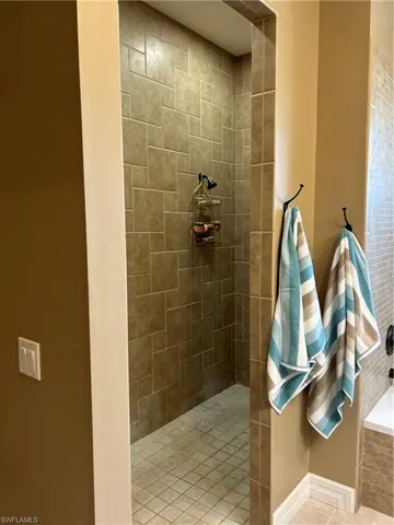 Bathroom featuring tiled shower
