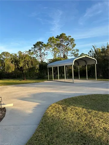 View of property's community featuring a lawn
