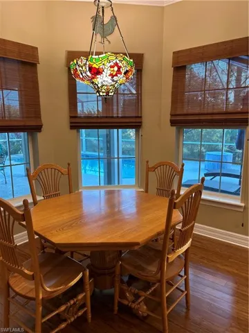 Dining room featuring dark wood-type flooring