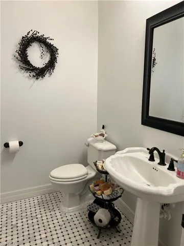 Bathroom featuring tile patterned flooring and toilet