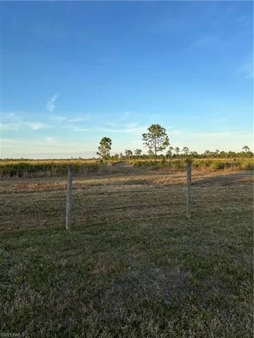 View of yard with a rural view