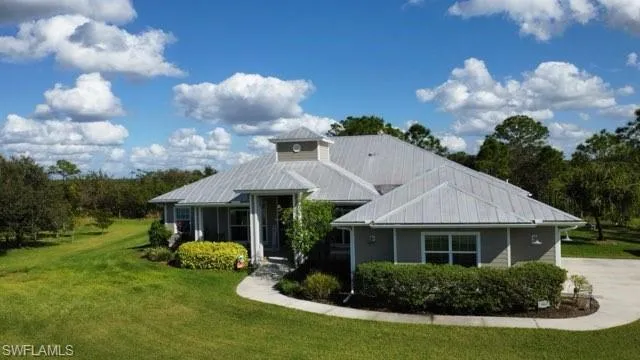View of front of house featuring a front lawn