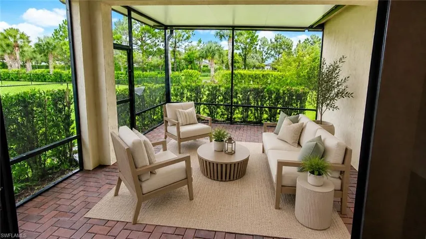 Screened patio featuring a herringbone-patterned brick paver floor and a stucco exterior wall