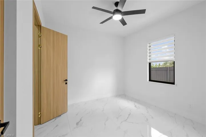 Unfurnished room with ceiling fan