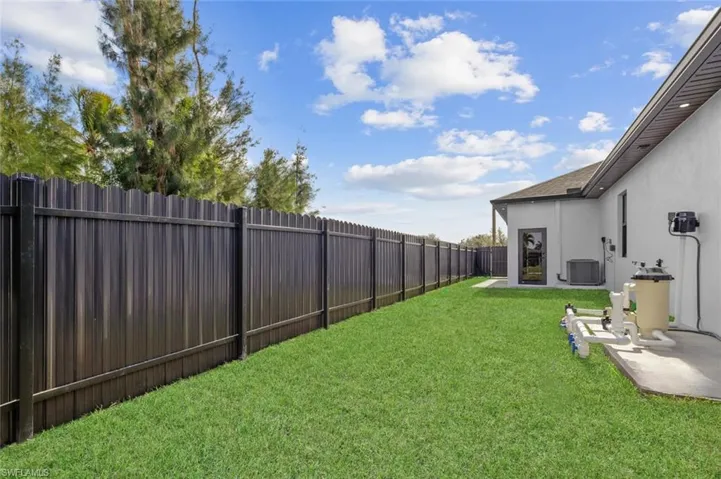 View of yard with a patio area and cooling unit