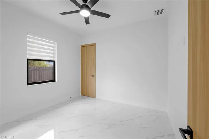 Unfurnished room with ceiling fan
