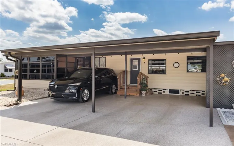 Large carport with extra driveway