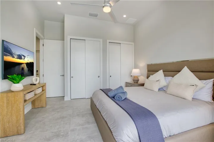 Bedroom featuring light-toned tile flooring and a neutral color palette