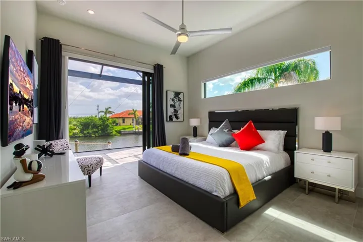 Expansive sliding glass doors provide water access