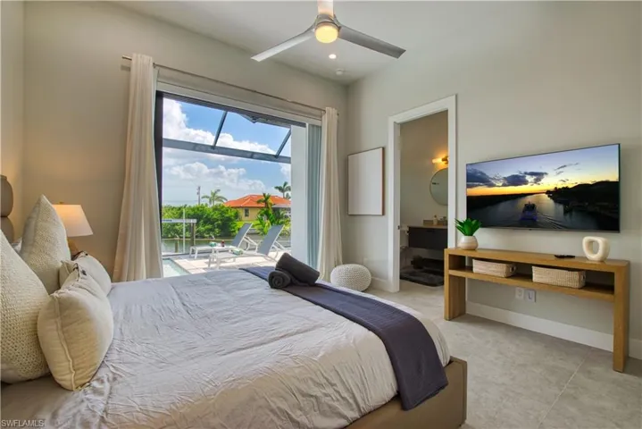 Bedroom with sliding glass doors opening to an outdoor patio