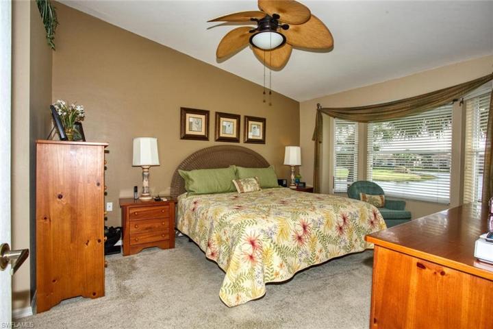 Primary bedroom with views of golf course