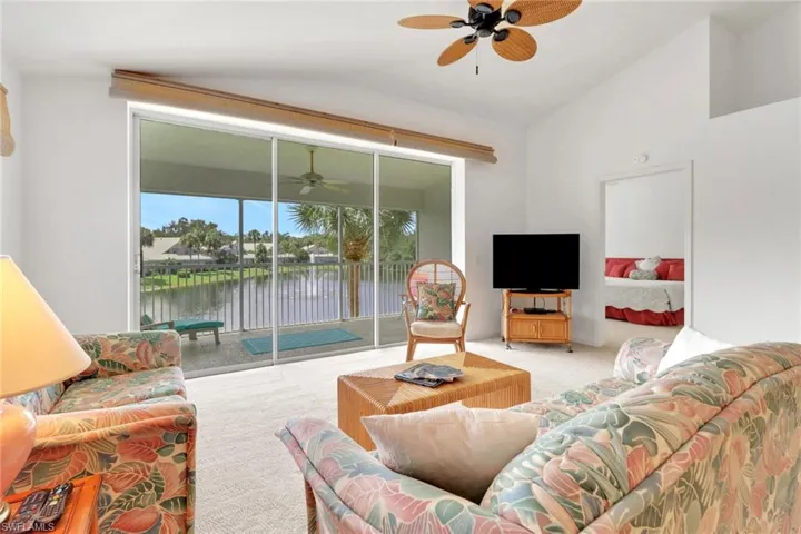 Living area with lots of natural light and lofted ceiling