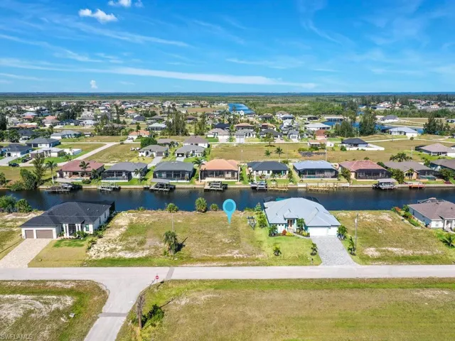 Aerial view with a water view and a residential view