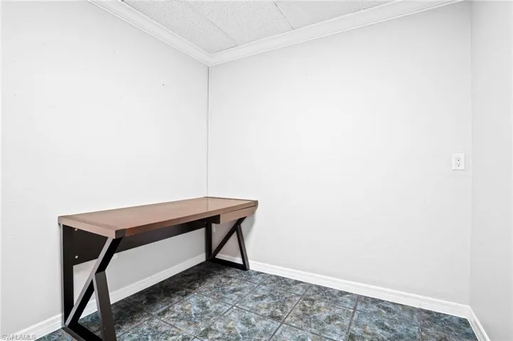 Unfurnished office with ornamental molding