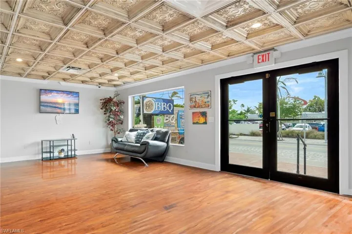 Entry way featuring plenty of natural light, french doors, and coffered ceiling