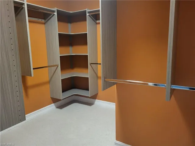 Master bedroom walking closets with shelvings