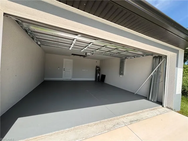 Garage featuring water heater