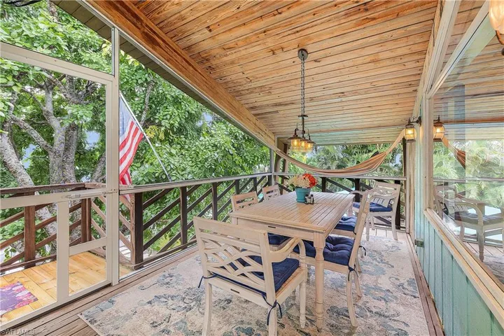 screened porch with dining