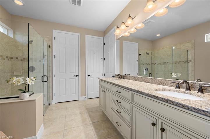 15045 Malayan Court Bonita Springs FL 34135 - Owner's bath with linen closet and large walk in closet
