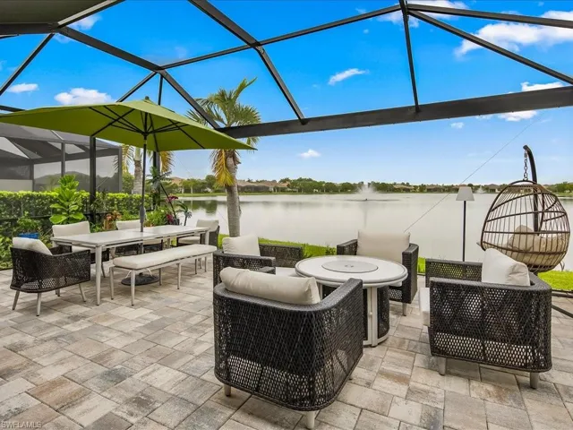 Sunroom / solarium with a water view