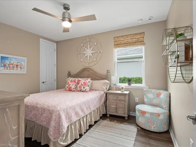 Bedroom featuring hardwood / wood-style flooring and ceiling fan