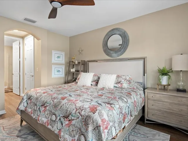 Bedroom with wood-type flooring and ceiling fan