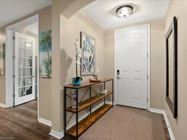 Entryway featuring dark wood-type flooring