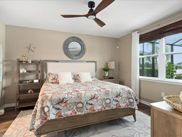 Bedroom with wood-type flooring and ceiling fan
