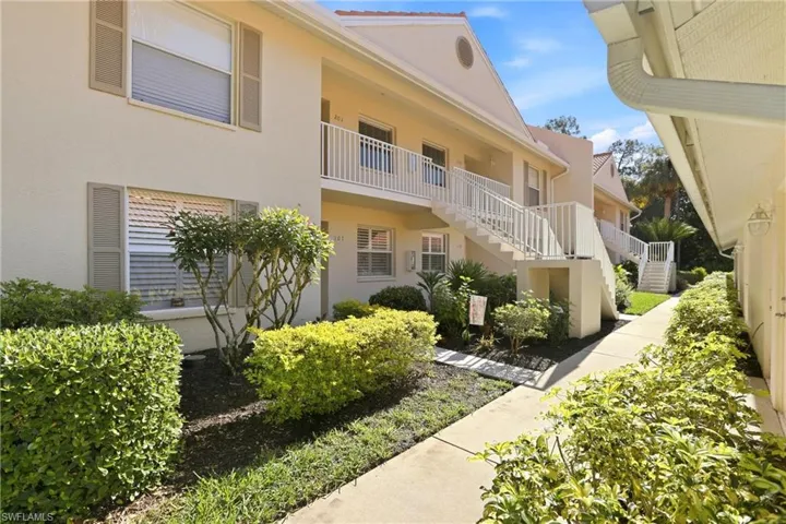 View of apartment building / complex featuring stairway