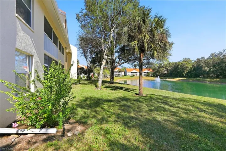View of green lawn with a water view