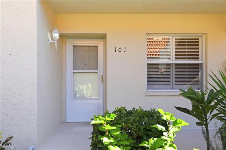 View of exterior entry featuring stucco siding
