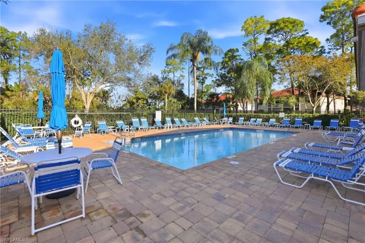 Community pool with a patio area