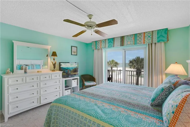 Gulf views from the Primary Bedroom impact sliders.