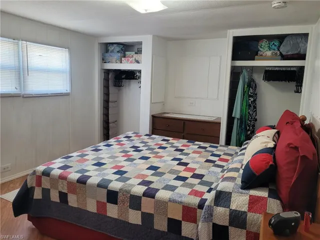 Bedroom featuring a closet and hardwood / wood-style flooring