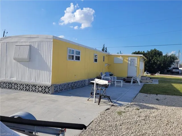 Rear view of property with a patio area