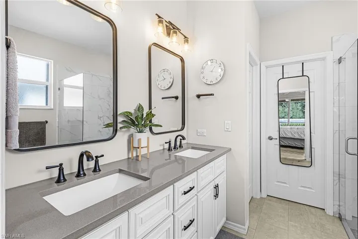 Dual vanity with undermount sinks and gray countertops