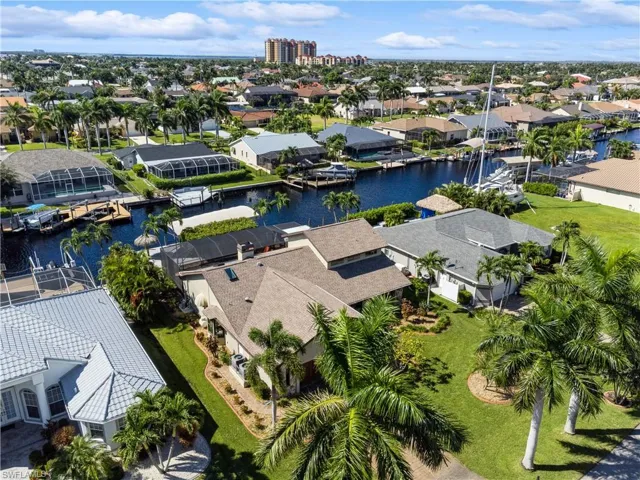 Aerial view of home and canal   Lush Landscaping  - Automatic Sprinklers