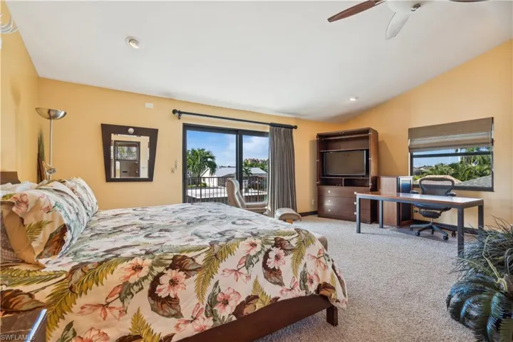 Second Master Suite - Occupies the entire second floor Sliding Glass Doors to a lanai, carpet flooring, ceiling fan walk in closet.