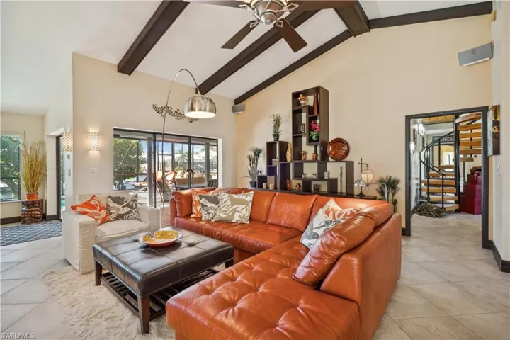 Furnishings convey with the home. One of two gathering spaces.