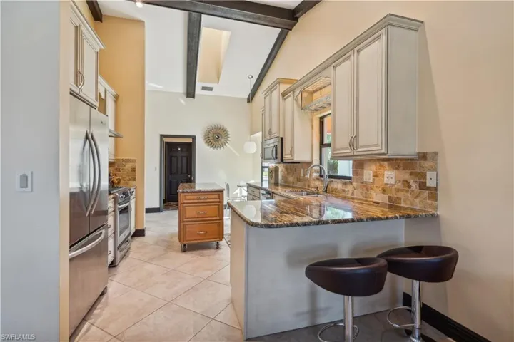 Kitchen Breakfast Bar.  Sunlights in ceiling