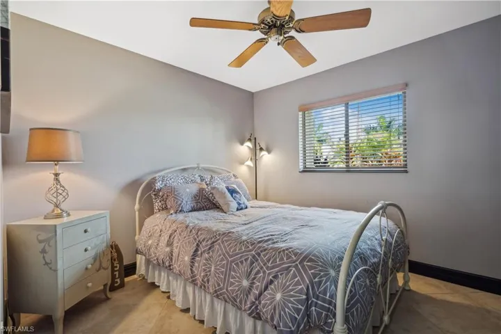 Guest Bedroom (first floor)  #2 - ceiling fan and light tile patterned flooring